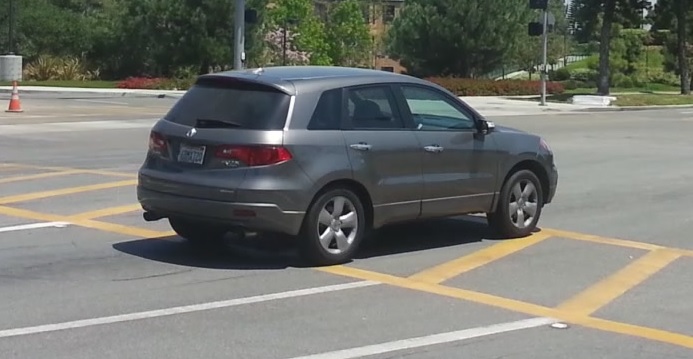 Sample frame as rear wheel of vehicle crosses stop line